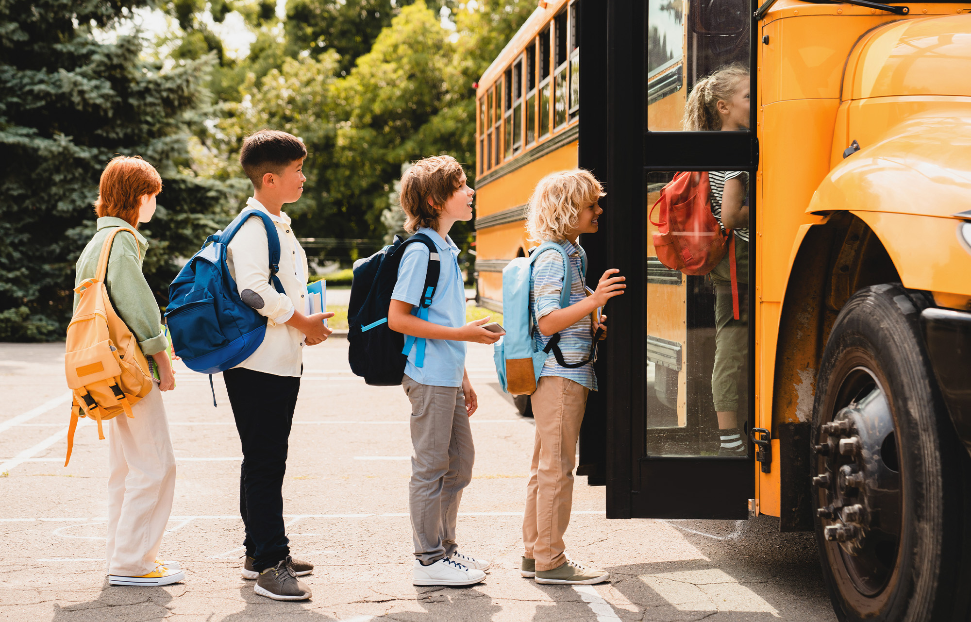 Kids getting on a school bus